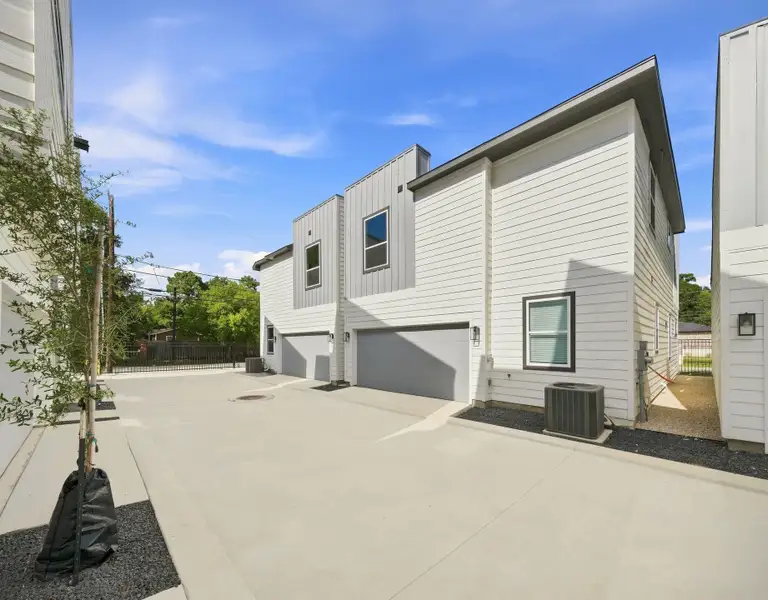 Another view of the private community drive and rear-entry garages, showcasing the clean, thoughtfully designed layout of Highland Heights Crossing. Another view of the private community drive and rear-entry garages, showcasing the clean, thoughtfully designed layout of Highland Heights Crossing.