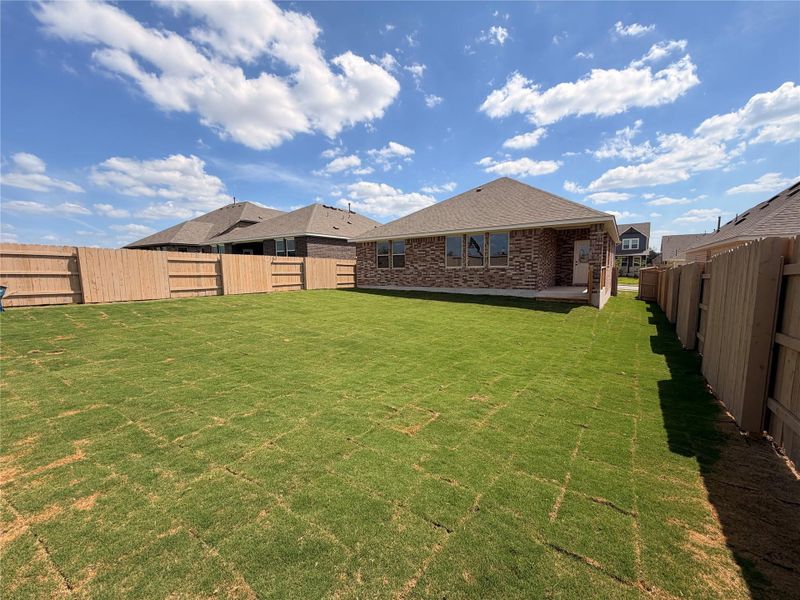 Exterior details and patio area of a home in The Colony, Bastrop (Image 10).