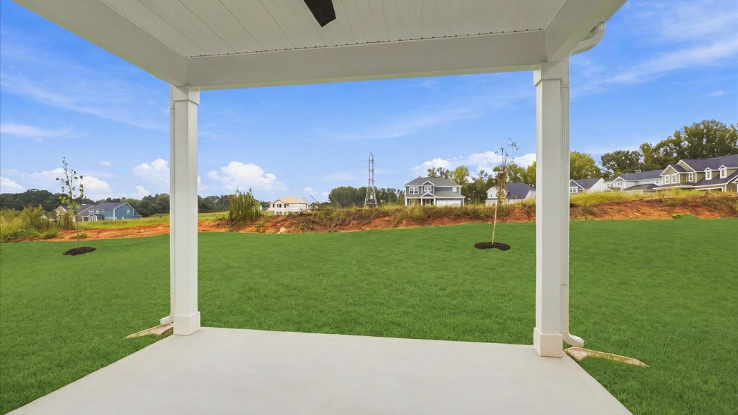 Tasteful rear porch provides a peaceful retreat and effortless indoor-outdoor flow at the Fox Hollow community