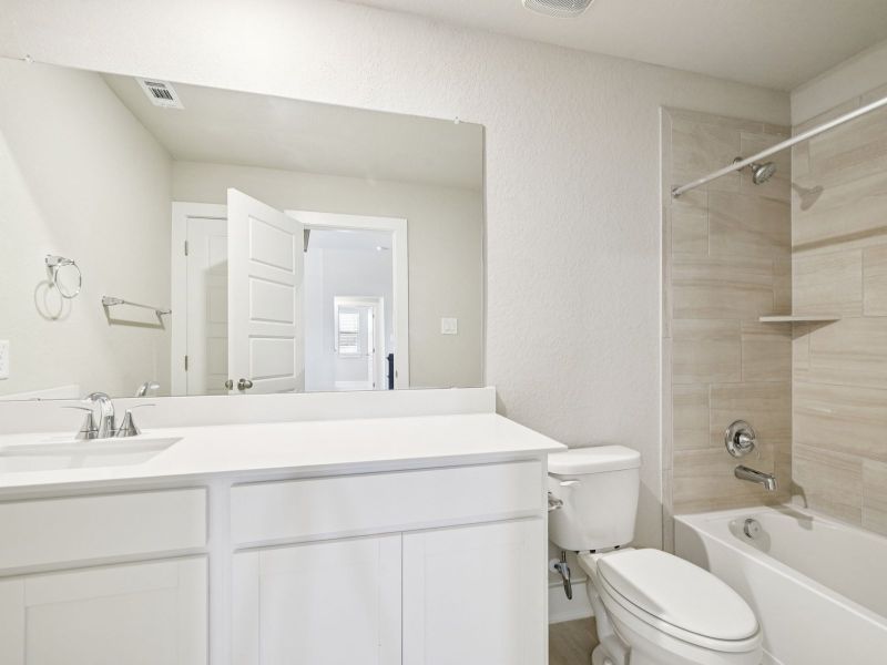 Guest bathroom in the Red River floorplan at a Meritage Homes community.