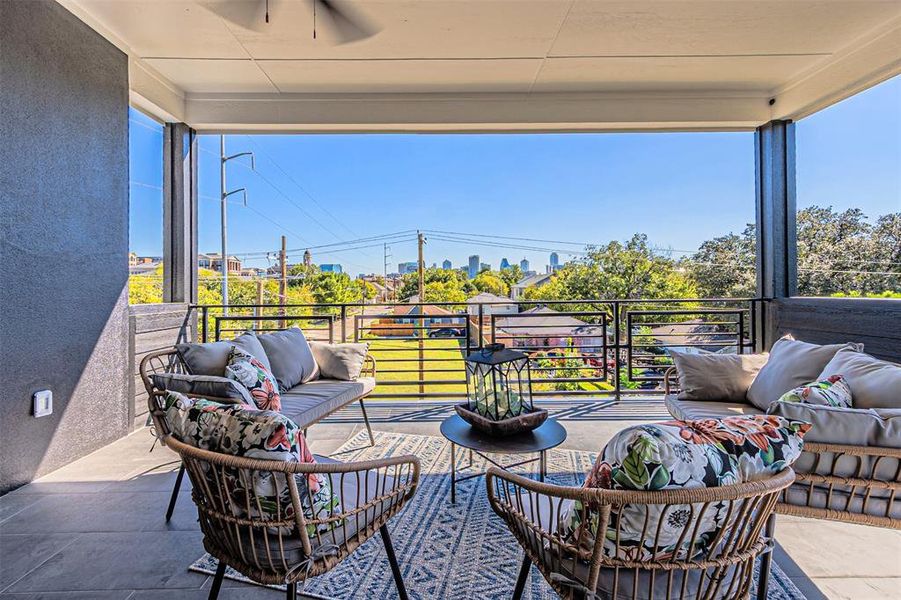 View of patio featuring an outdoor hangout area, ceiling fan, and a view of city View of patio featuring an outdoor hangout area, ceiling fan, and a view of city