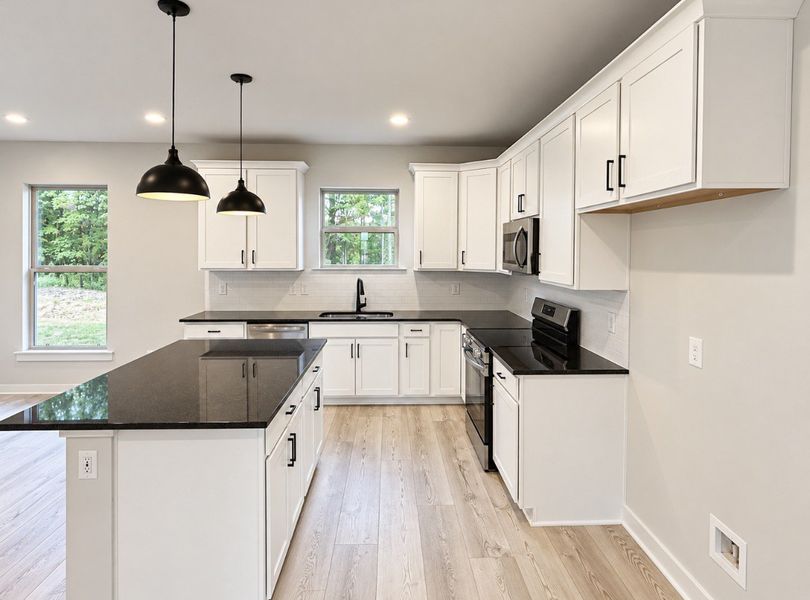 Furnished interior view inside a new home in Hickory Cove, Burns (Image 8).