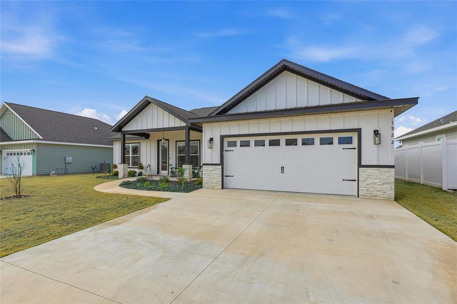 Front exterior of a new home in , Newberry, FL, highlighting curb appeal (Image 21).