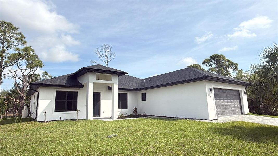 Front exterior of a new home in , Port Charlotte, FL, highlighting curb appeal (Image 1). Front exterior of a new home in , Port Charlotte, FL, highlighting curb appeal (Image 1).
