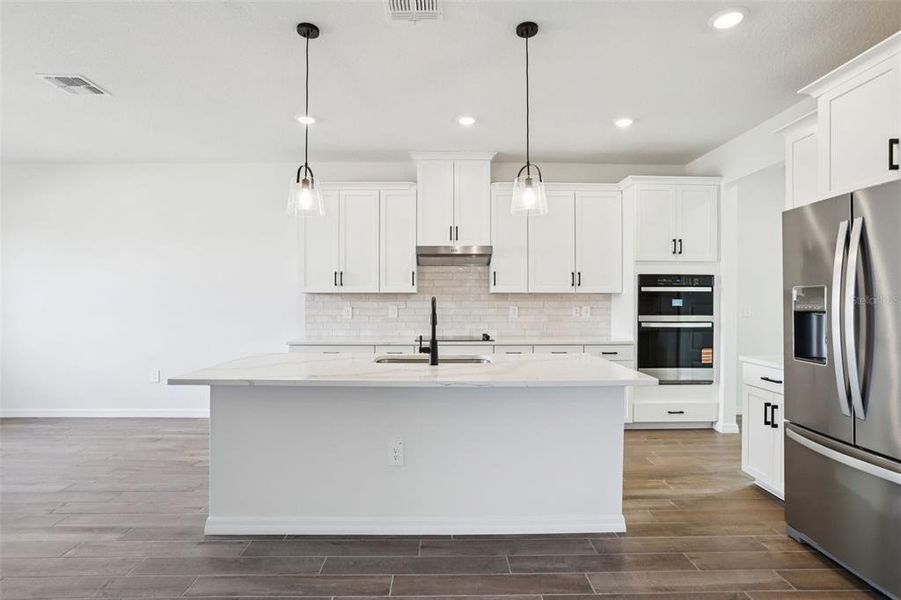 Furnished interior view inside a new home in Two Rivers - Signature Series, Zephyrhills (Image 8). Furnished interior view inside a new home in Two Rivers - Signature Series, Zephyrhills (Image 8).