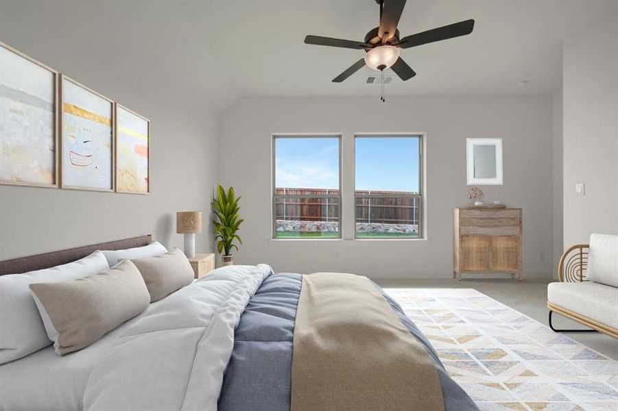 Bedroom featuring carpet floors and ceiling fan Bedroom featuring carpet floors and ceiling fan
