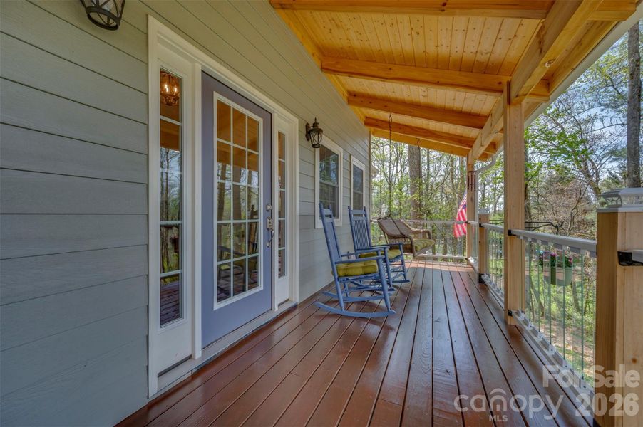 Fabulous covered front porch with tempered glass pickets,.what a nice touch! Fabulous covered front porch with tempered glass pickets,.what a nice touch!