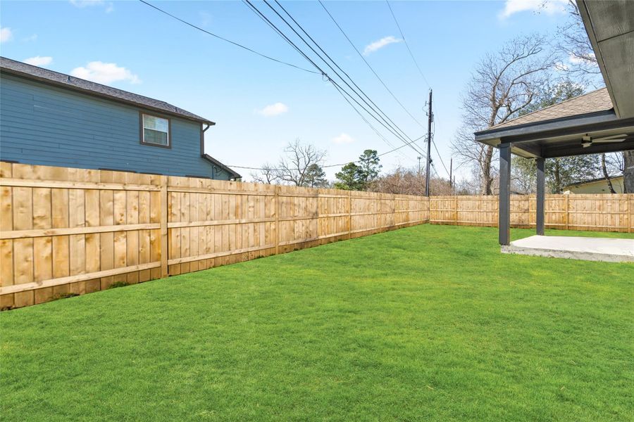Fully fenced backyard providing safety for pets and kids, with endless potential for outdoor enjoyment.