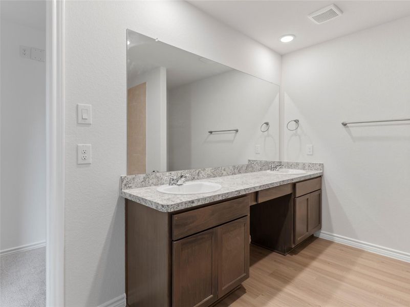 Luxurious master bath featuring a sleek double vanity. Luxurious master bath featuring a sleek double vanity.