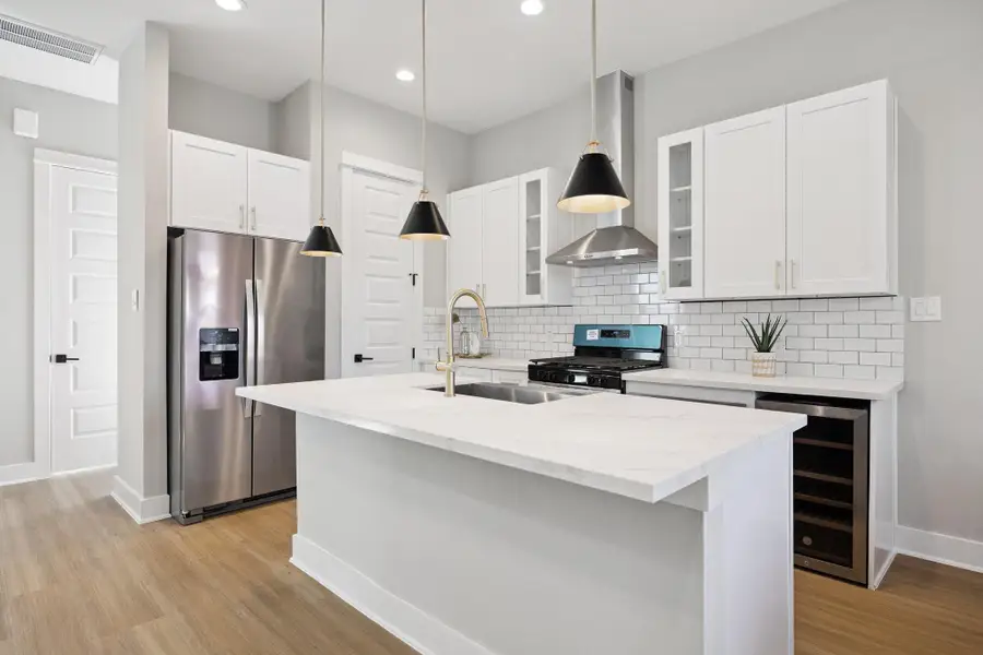 Spacious kitchen with island and new stainless steel appliances Spacious kitchen with island and new stainless steel appliances