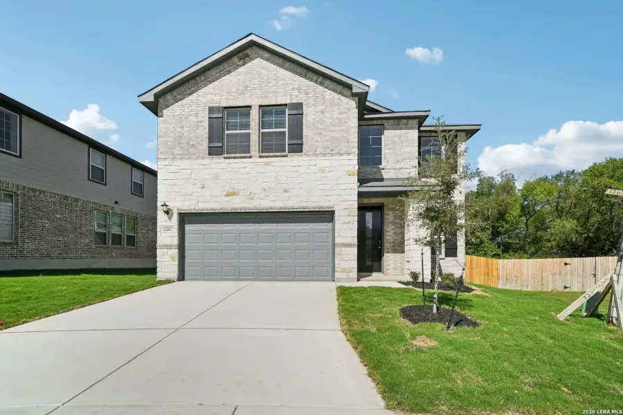 Front exterior of a new home in Comanche Ridge, San Antonio, TX, highlighting curb appeal (Image 24).
