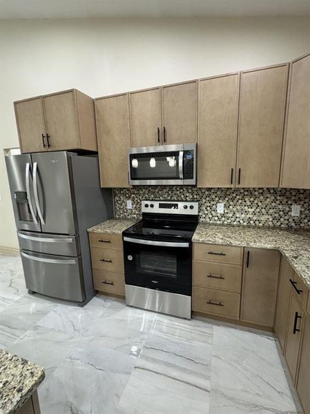 Furnished interior view inside a new home in , Okeechobee (Image 8).