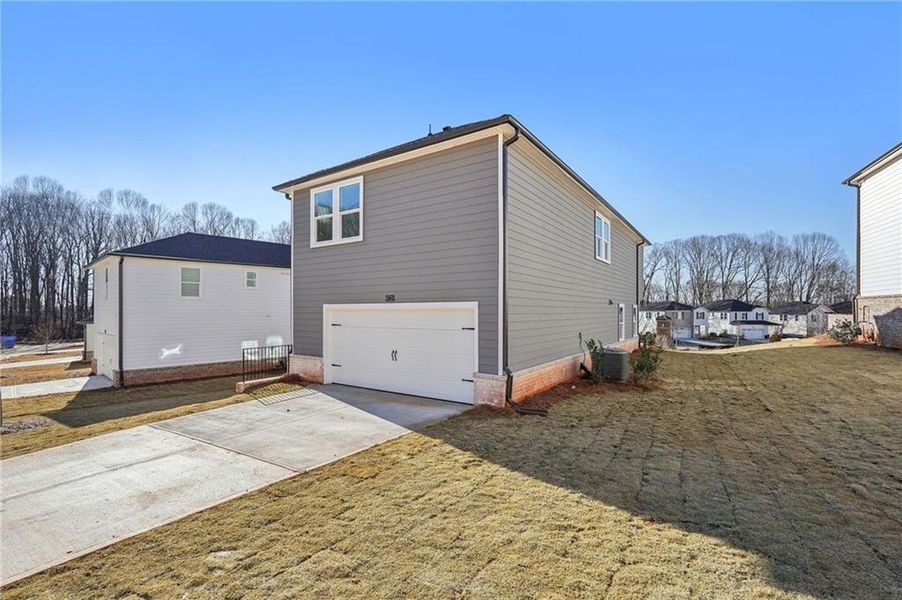 Exterior details and patio area of a home in Hemingway - Cottage Series, Cumming (Image 18).