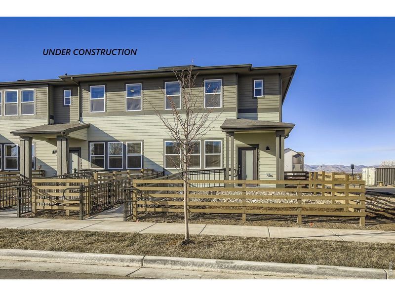 Front exterior of a new home in Waterfield, Fort Collins, CO, highlighting curb appeal (Image 2). Front exterior of a new home in Waterfield, Fort Collins, CO, highlighting curb appeal (Image 2).