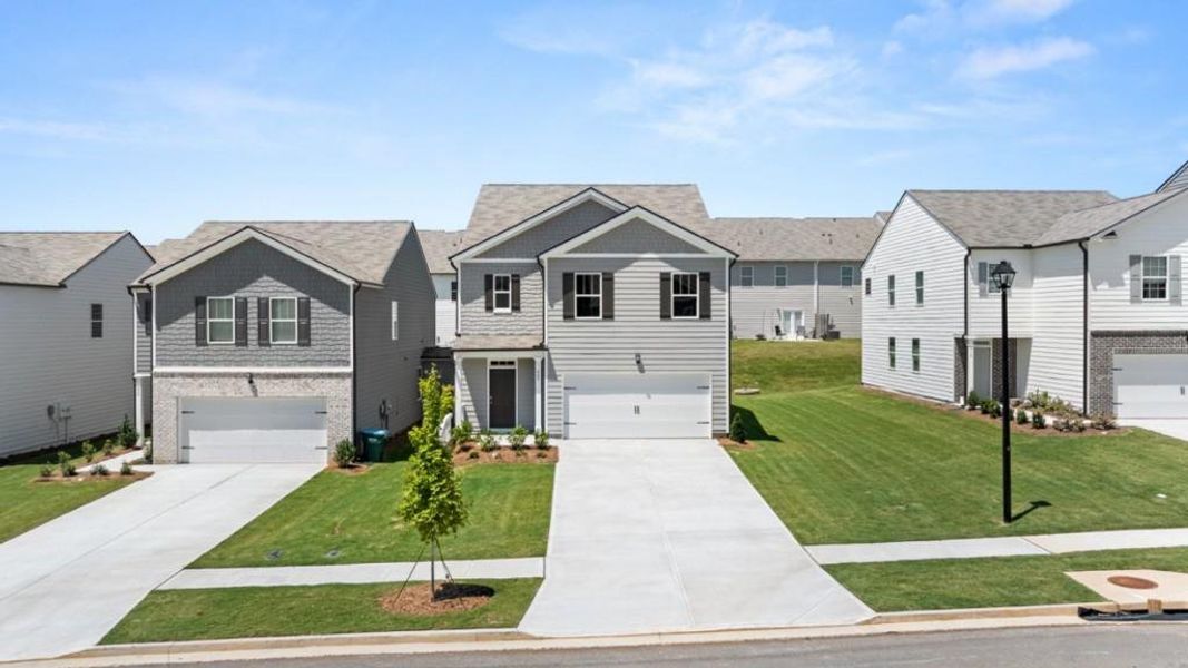 Front exterior of a new home in Rolling Meadows, Jasper, GA, highlighting curb appeal (Image 2). Front exterior of a new home in Rolling Meadows, Jasper, GA, highlighting curb appeal (Image 2).