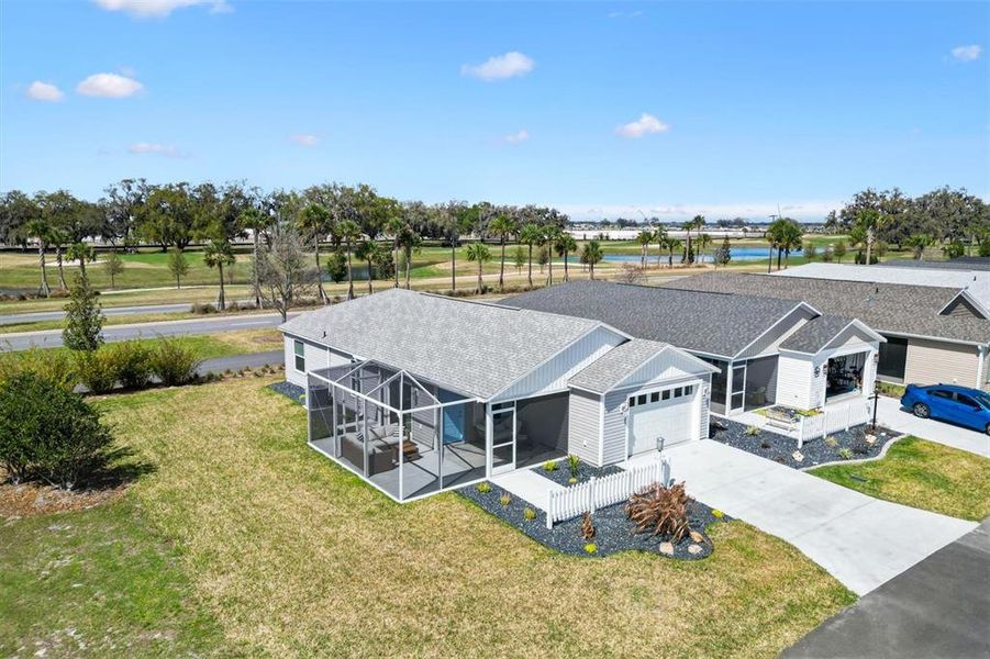 Front exterior of a new home in , The Villages, FL, highlighting curb appeal (Image 1). Front exterior of a new home in , The Villages, FL, highlighting curb appeal (Image 1).