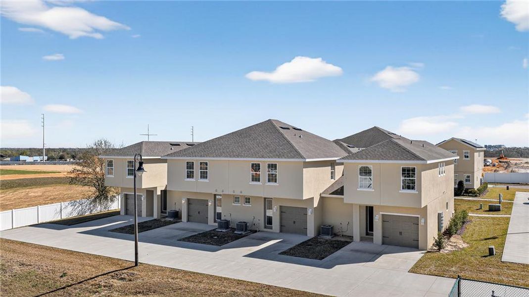 Front exterior of a new home in , Davenport, FL, highlighting curb appeal (Image 26).