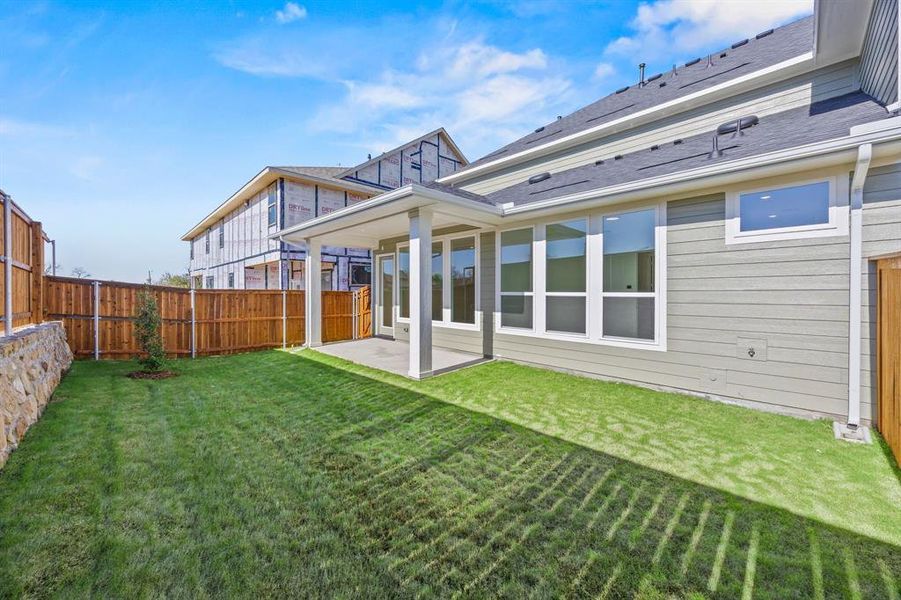 Exterior details and patio area of a home in North Square at Uptown, Celina (Image 2). Exterior details and patio area of a home in North Square at Uptown, Celina (Image 2).