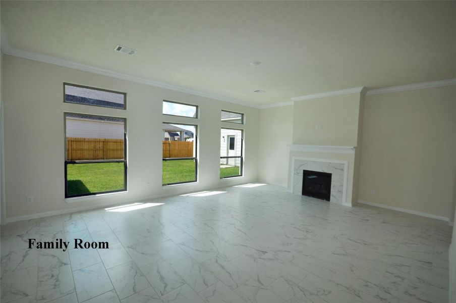 Open and well lit Family Room with a Directly vented and remotely controlled gas fireplace.  Enjoy the cosy atmosphere and then click it off and go to bed. No muss, no fuss!