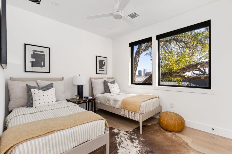 Bedroom with wood finished floors, ceiling fan, and recessed lighting Bedroom with wood finished floors, ceiling fan, and recessed lighting