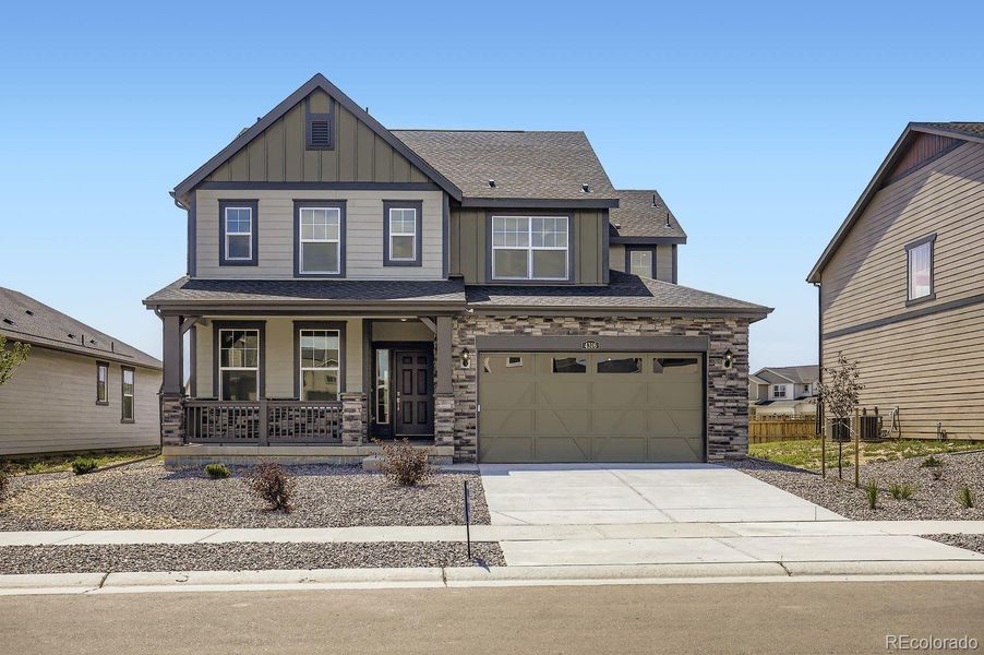 Front exterior of a new home in Ledge Rock: The Monarch Collection, Johnstown, CO, highlighting curb appeal (Image 13).