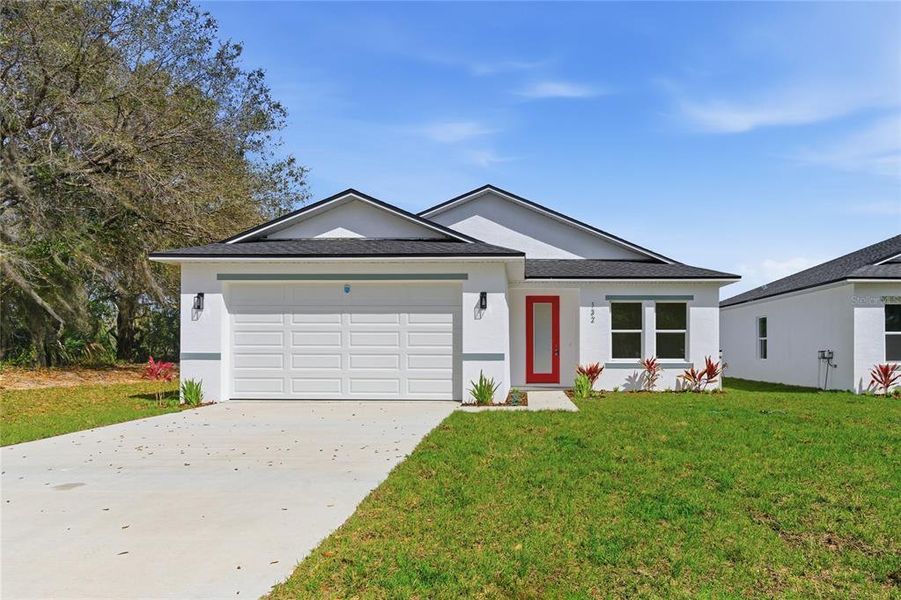 Front exterior of a new home in , Osteen, FL, highlighting curb appeal (Image 24).
