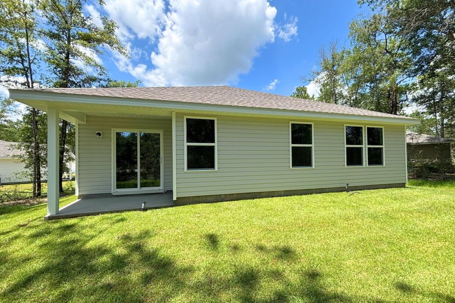 A house with a grass yard.