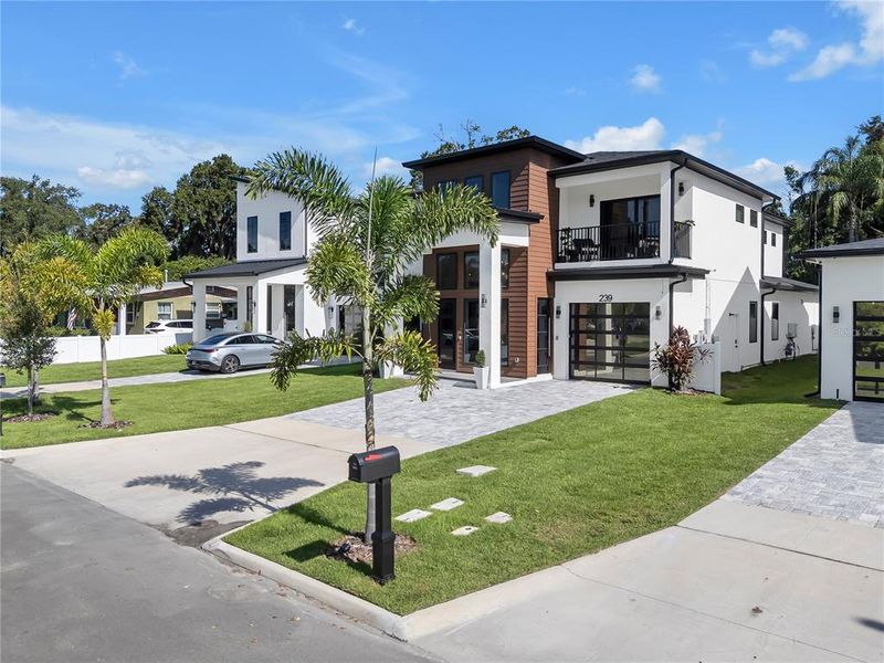 Front exterior of a new home in , Orlando, FL, highlighting curb appeal (Image 22).