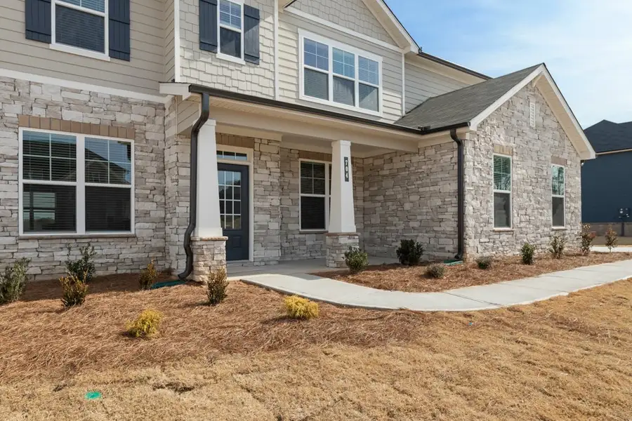 A house with a gravel driveway. A house with a gravel driveway.