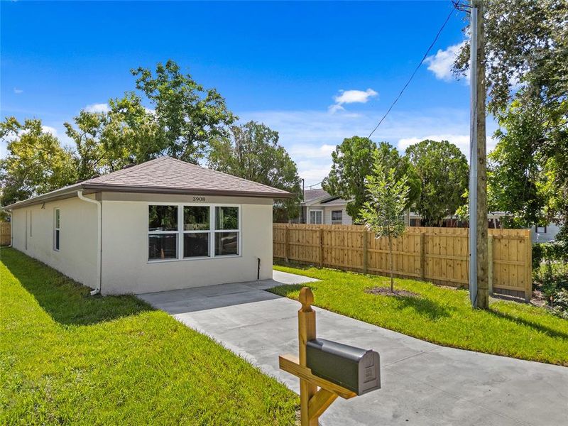 Front exterior of a new home in , Sarasota, FL, highlighting curb appeal (Image 21).