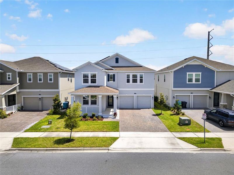 Front exterior of a new home in , Orlando, FL, highlighting curb appeal (Image 24). Front exterior of a new home in , Orlando, FL, highlighting curb appeal (Image 24).