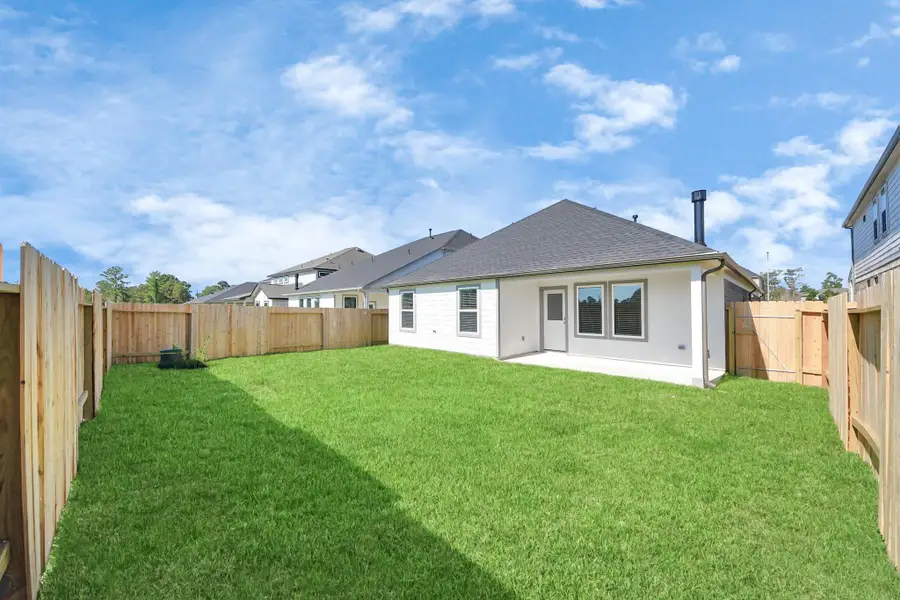 Explore the expansive backyard with its inviting covered patio—a perfect blend of space for the kids to play and adults to unwind. Ideal for creating your outdoor oasis, this backyard accommodates patio furniture, a BBQ pit, and endless possibilities for leisure and entertainment. Sample photo of completed home with similar floor plan. Actual colors and selections may vary. Explore the expansive backyard with its inviting covered patio—a perfect blend of space for the kids to play and adults to unwind. Ideal for creating your outdoor oasis, this backyard accommodates patio furniture, a BBQ pit, and endless possibilities for leisure and entertainment. Sample photo of completed home with similar floor plan. Actual colors and selections may vary.