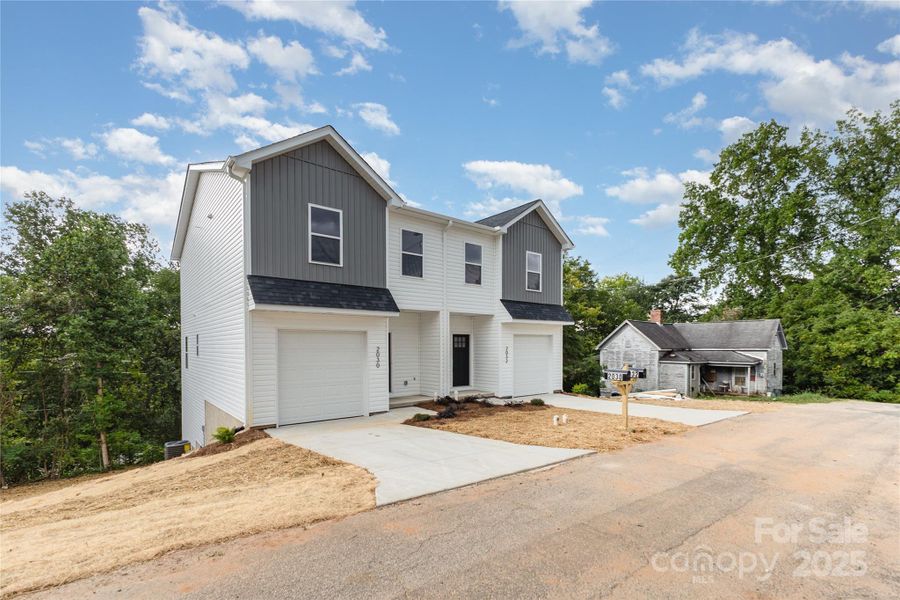 Front exterior of a new home in , Hickory, NC, highlighting curb appeal (Image 23).