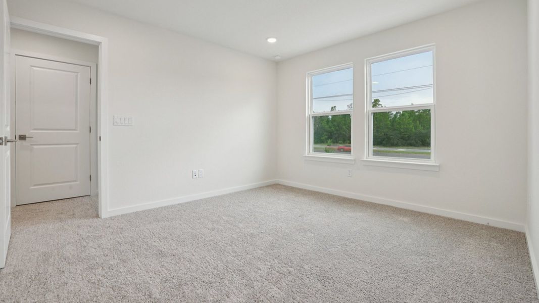 Primary suite with en suite Bath of the Coronado - End at Cyrene at Harmony located in St Cloud FL by DRB Homes