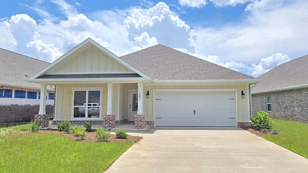 Front exterior of a new home in Owl's Head Farms, Freeport, FL, highlighting curb appeal (Image 1). Front exterior of a new home in Owl's Head Farms, Freeport, FL, highlighting curb appeal (Image 1).