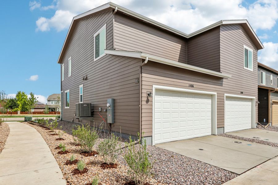 Front exterior of a new home in Spring Valley, Longmont, CO, highlighting curb appeal (Image 2). Front exterior of a new home in Spring Valley, Longmont, CO, highlighting curb appeal (Image 2).