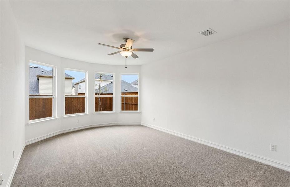 Primary suite with large windows Primary suite with large windows