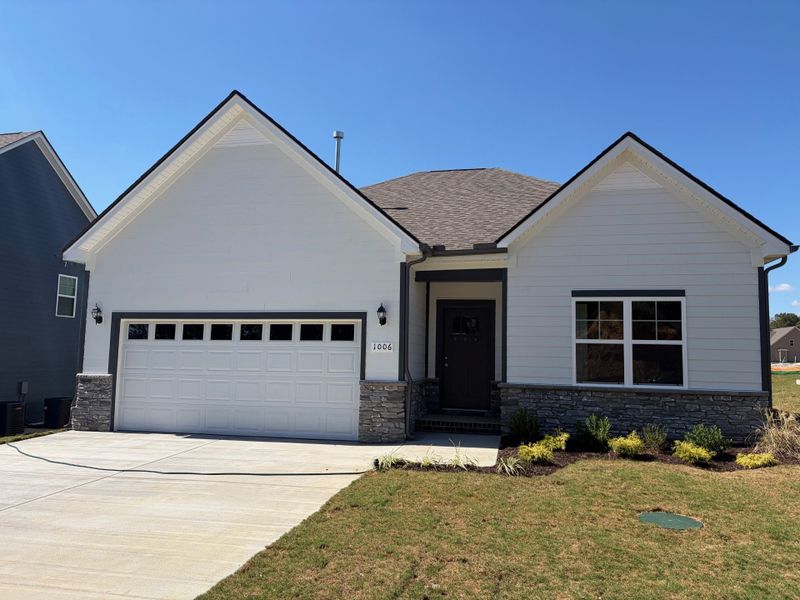 Front exterior of a new home in Cumberland Estates, Fairview, TN, highlighting curb appeal (Image 1).