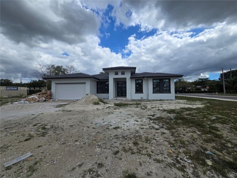 Front exterior of a new home in , Miami, FL, highlighting curb appeal (Image 19).