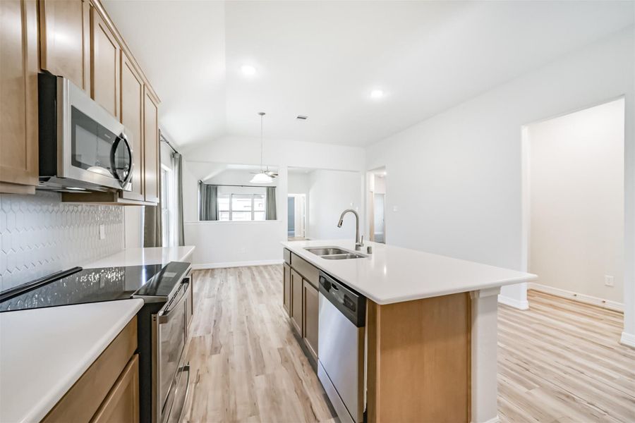 The island also features a convenient double basin sink and dishwasher, making cleanup effortless. The open layout lets you easily converse with guests while prepping meals, keeping the space social and connected. The island also features a convenient double basin sink and dishwasher, making cleanup effortless. The open layout lets you easily converse with guests while prepping meals, keeping the space social and connected.