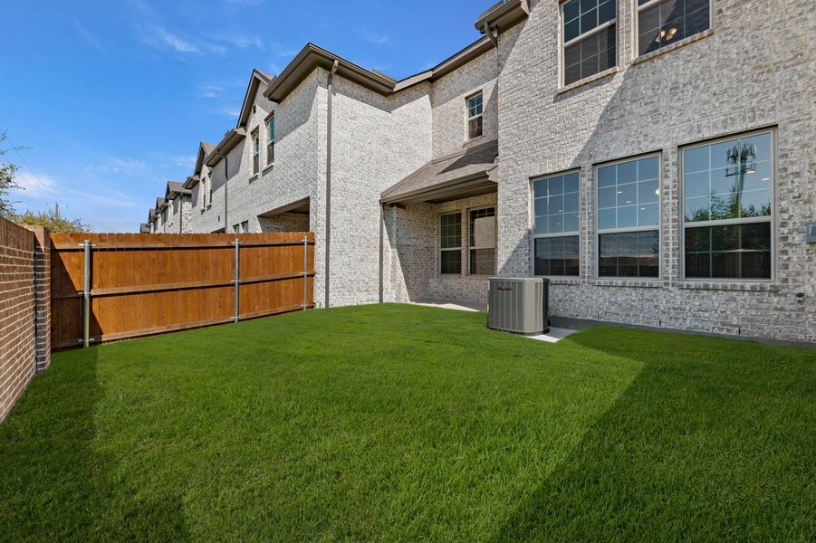 Front exterior of a new home in Main Street Village, Mansfield, TX, highlighting curb appeal (Image 28). Front exterior of a new home in Main Street Village, Mansfield, TX, highlighting curb appeal (Image 28).