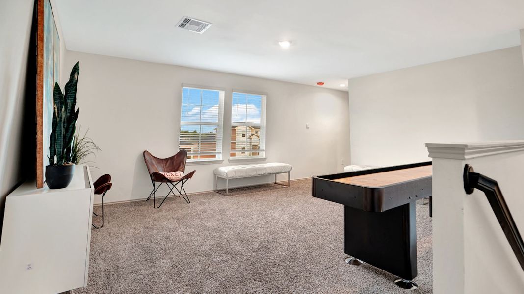 Representative furnished interior of a home built from the MITCHELL by D.R. Horton in Westward Pointe, Sealy (Image 13).