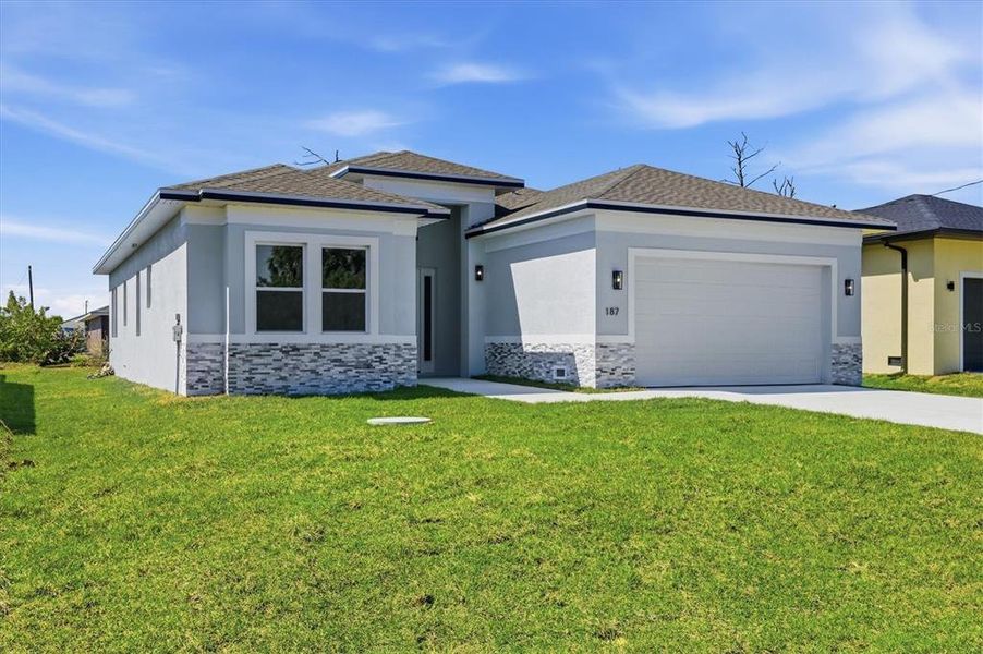 Front exterior of a new home in , Rotonda West, FL, highlighting curb appeal (Image 1). Front exterior of a new home in , Rotonda West, FL, highlighting curb appeal (Image 1).