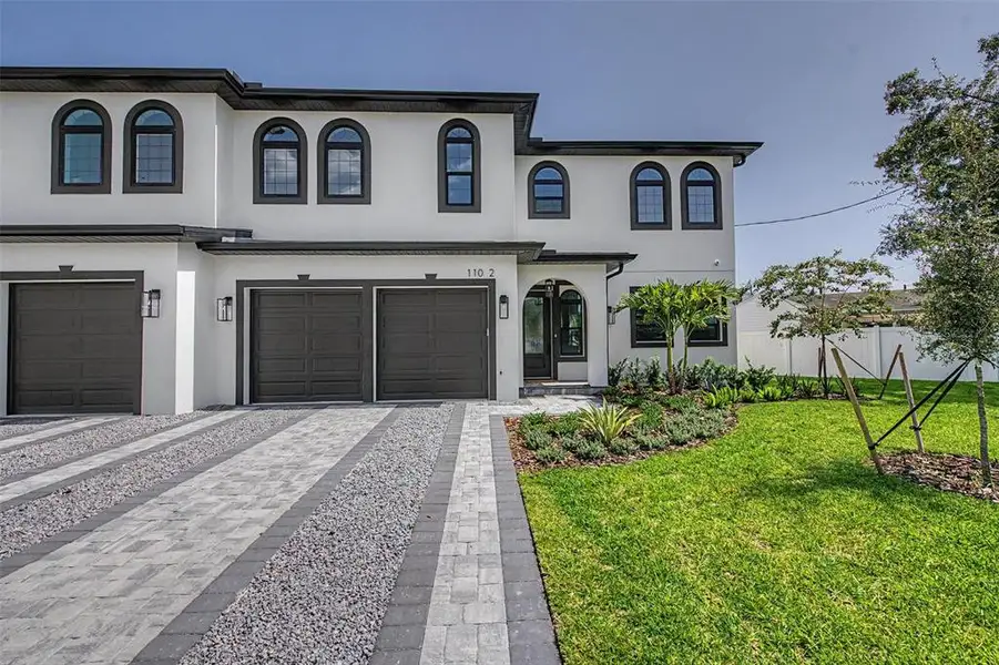 Front exterior of a new home in , Tampa, FL, highlighting curb appeal (Image 25). Front exterior of a new home in , Tampa, FL, highlighting curb appeal (Image 25).
