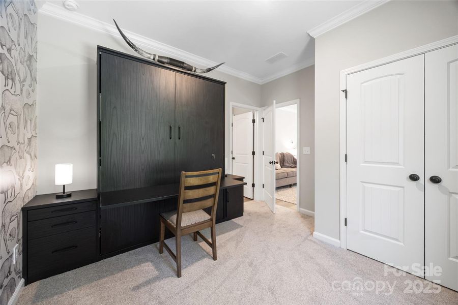 Guest bedroom/office on the main features a murphy bed/desk combo. Guest bedroom/office on the main features a murphy bed/desk combo.