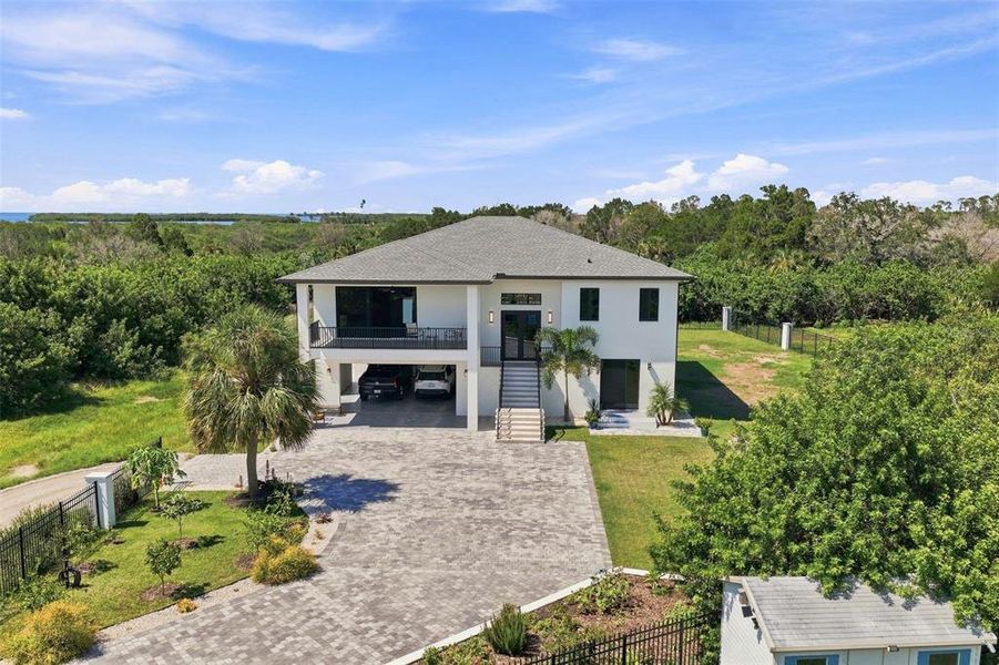 Front exterior of a new home in , Port Richey, FL, highlighting curb appeal (Image 23).