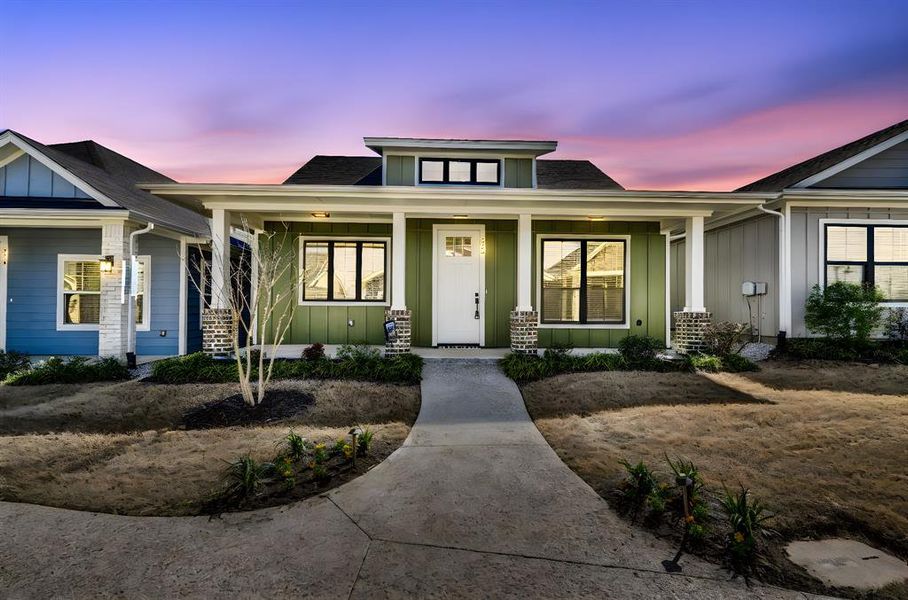 View of front facade featuring board and batten siding, a porch, and roof with shingles View of front facade featuring board and batten siding, a porch, and roof with shingles