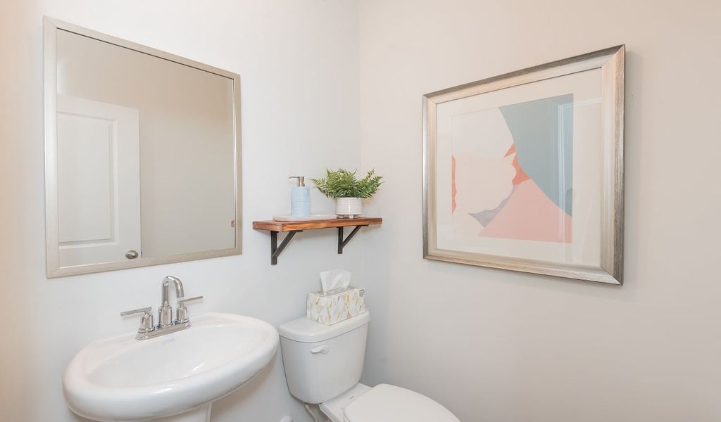 A convenient powder room is located on the main level.