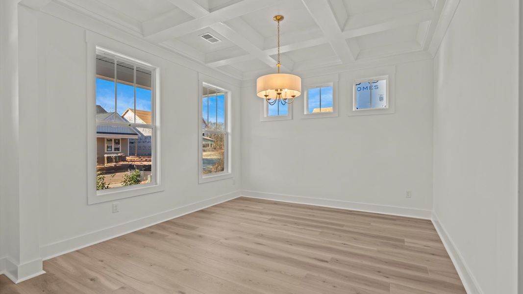 Exclusive dining area with coffered ceiling and refined finishes in a reputable Greenville location