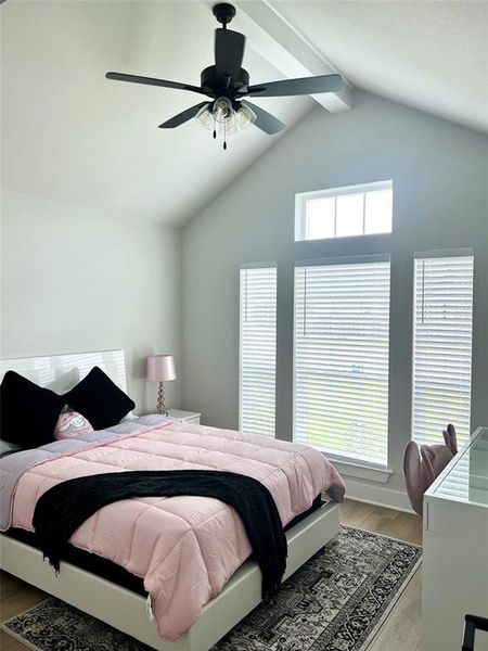Bedroom featuring light wood-style floors and ceiling fan Bedroom featuring light wood-style floors and ceiling fan